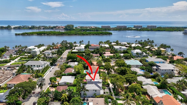 bird's eye view featuring a residential view and a water view