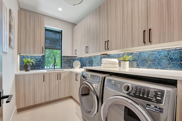 115 Gregory Rd, West Palm Beach, FL 33405 - laundry room featuring independent washer and dryer and cabinet space