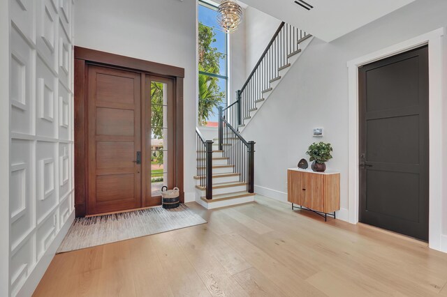 foyer entrance with light wood-type flooring