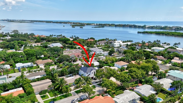 bird's eye view with a water view and a residential view