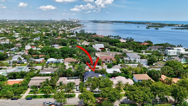 birds eye view of property with a water view