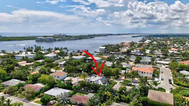 birds eye view of property featuring a water view