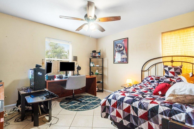 bedroom with ceiling fan and tile patterned flooring