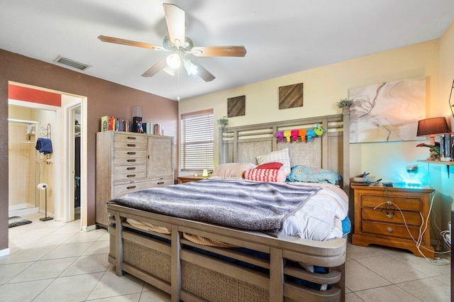 bedroom featuring ensuite bathroom, ceiling fan, and tile patterned flooring