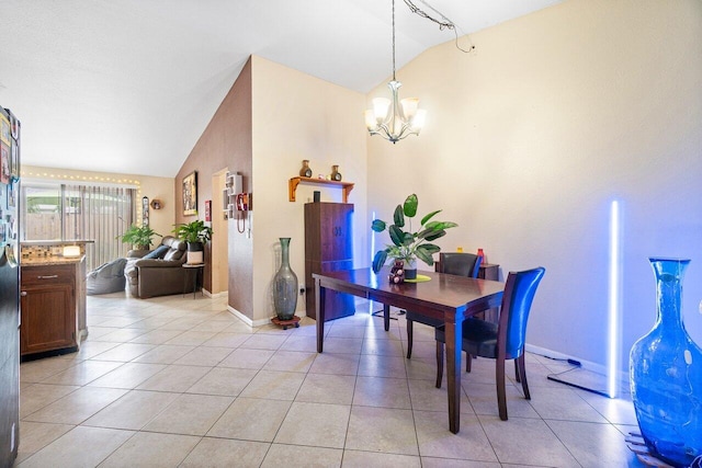 dining room featuring lofted ceiling, a notable chandelier, and light tile patterned floors