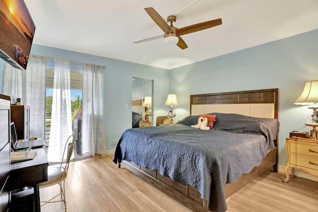 bedroom with ceiling fan and light hardwood / wood-style flooring