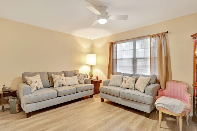 living room with ceiling fan and light hardwood / wood-style floors