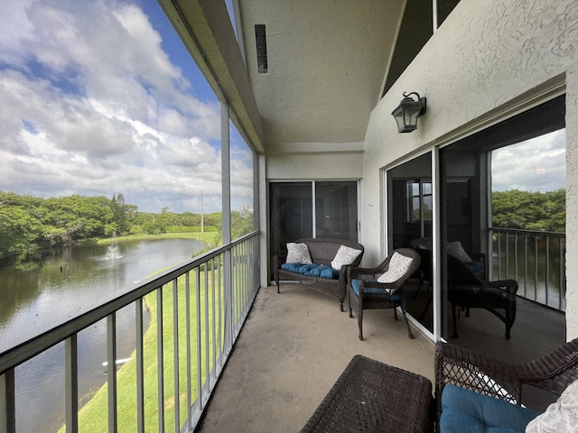 balcony featuring a water view