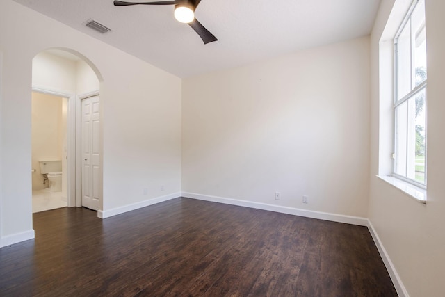 unfurnished room featuring ceiling fan and dark hardwood / wood-style flooring