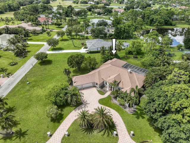 birds eye view of property with a water view