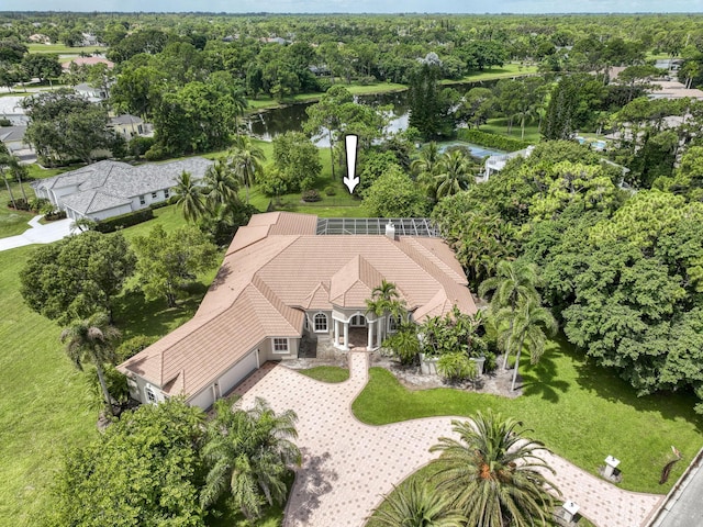 birds eye view of property with a water view