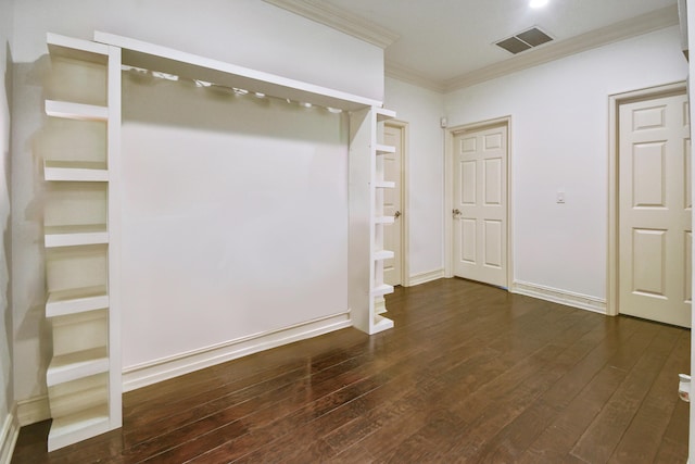 interior space featuring dark wood-type flooring and ornamental molding