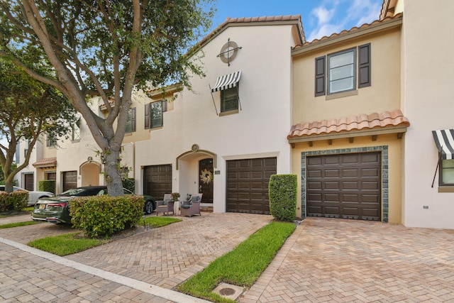 mediterranean / spanish-style house featuring a garage