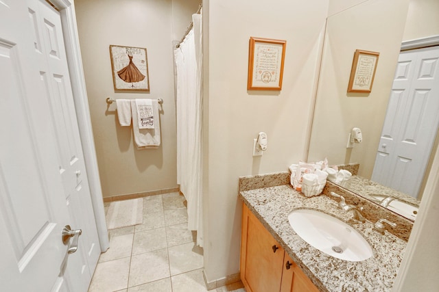 bathroom with vanity and tile patterned floors