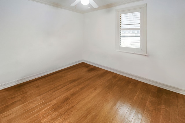 spare room featuring hardwood / wood-style floors, crown molding, and ceiling fan