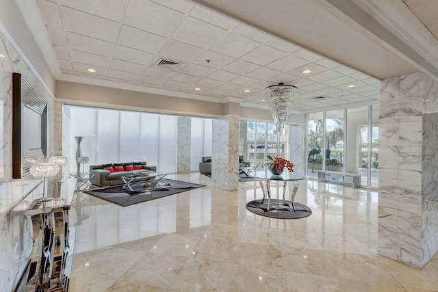 interior space with tile patterned floors, ornate columns, and ornamental molding