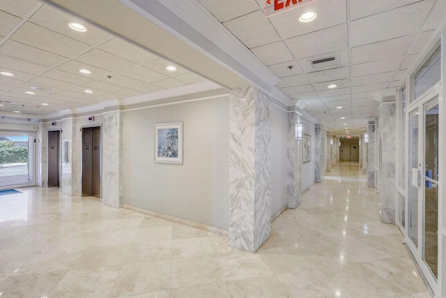 hallway with elevator, light tile patterned flooring, crown molding, and french doors