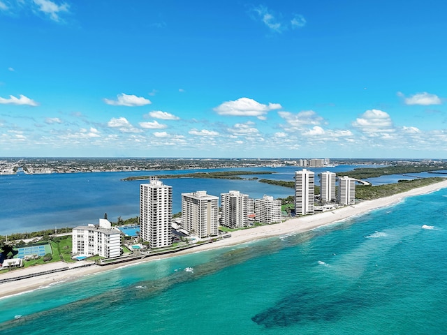 aerial view featuring a view of the beach and a water view