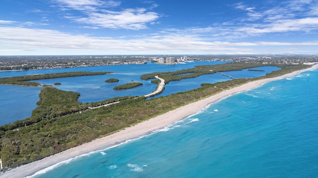 bird's eye view with a water view and a view of the beach