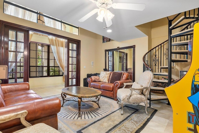 living room with ceiling fan and light tile patterned floors