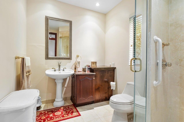 bathroom featuring tile patterned floors, toilet, and an enclosed shower