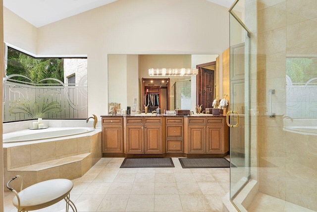 bathroom featuring vanity, tile patterned flooring, and independent shower and bath