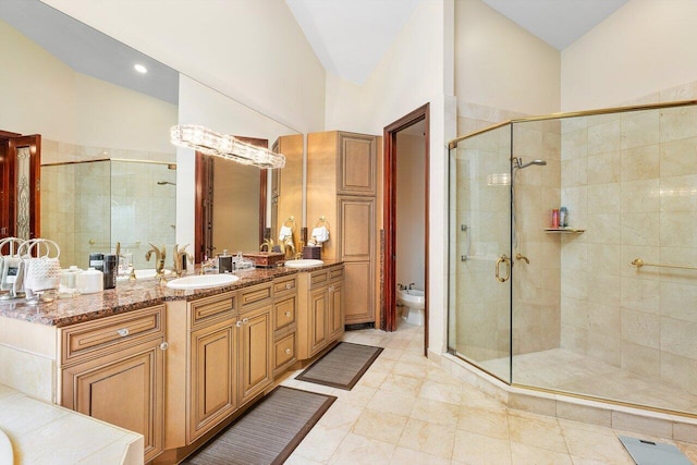 bathroom featuring a shower with door, a high ceiling, a bidet, tile patterned floors, and vanity