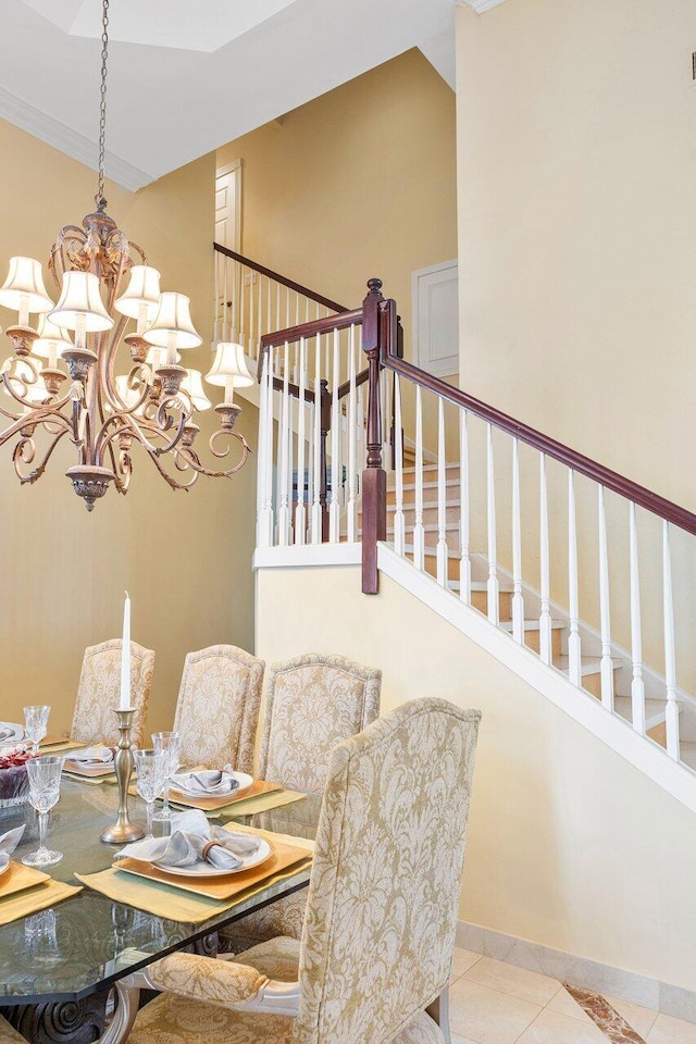 tiled dining space with a chandelier