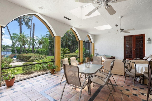 view of patio / terrace with ceiling fan and french doors