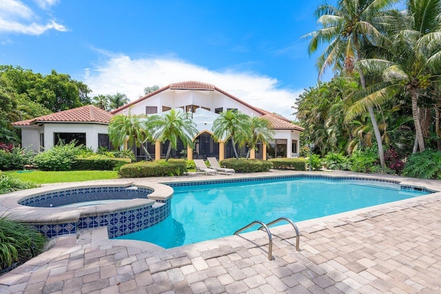 view of swimming pool featuring an in ground hot tub