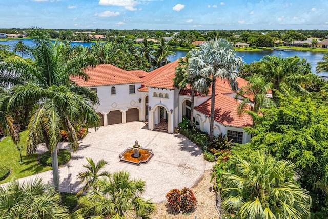 birds eye view of property with a water view