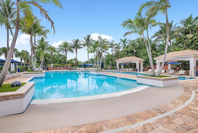 view of swimming pool with a gazebo and a patio