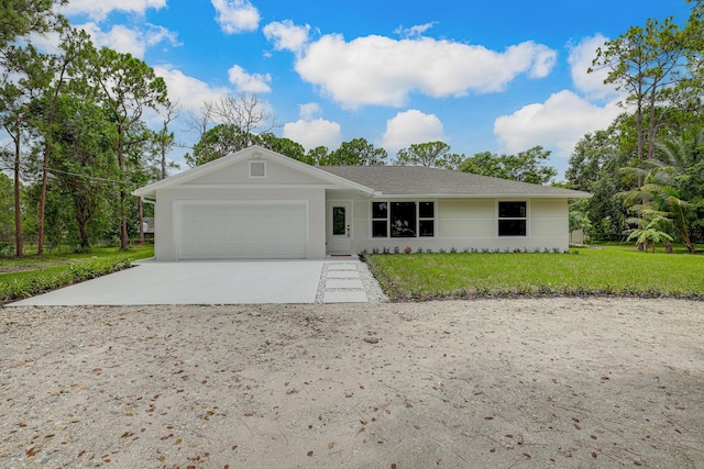 ranch-style house with a front yard and a garage