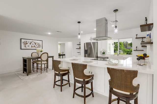 kitchen with stainless steel fridge with ice dispenser, white cabinetry, island exhaust hood, and hanging light fixtures