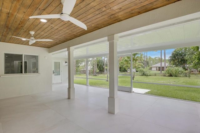 interior space featuring ceiling fan and wood ceiling