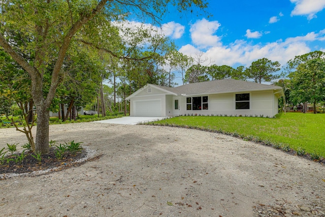 ranch-style home with a front yard and a garage