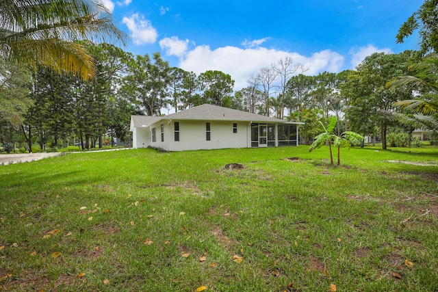 view of yard featuring a sunroom