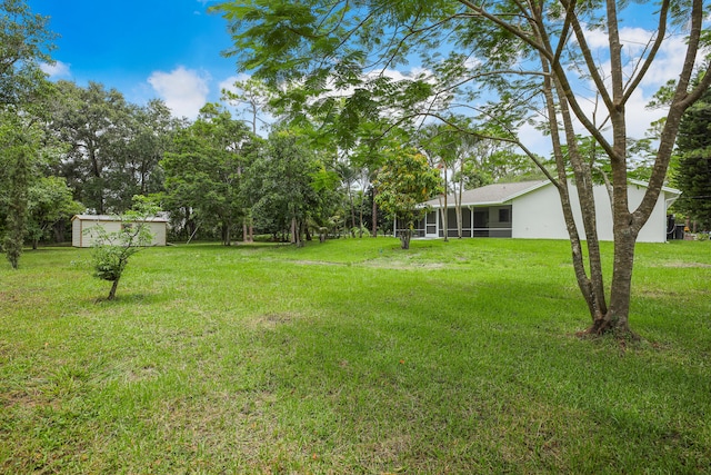 view of yard featuring a sunroom