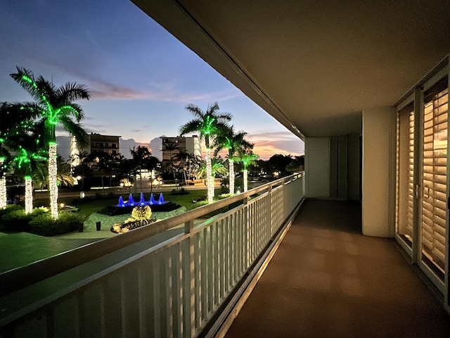 view of balcony at dusk