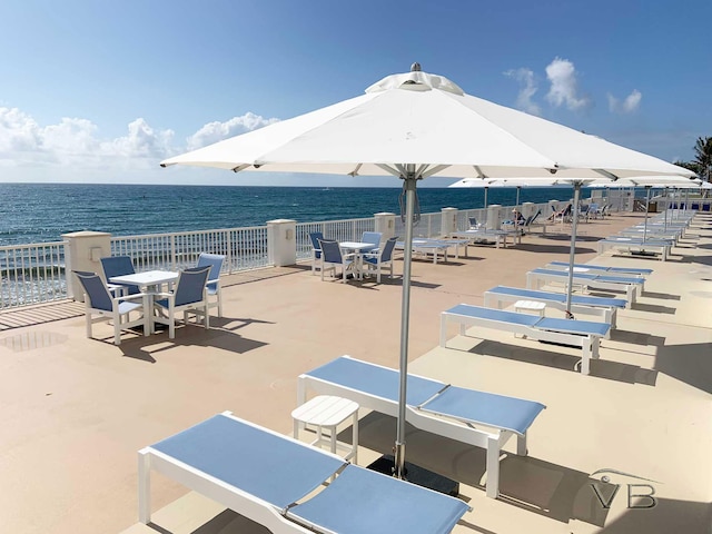 view of patio with a water view