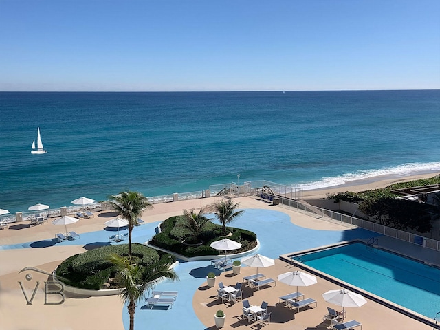 aerial view featuring a water view and a beach view