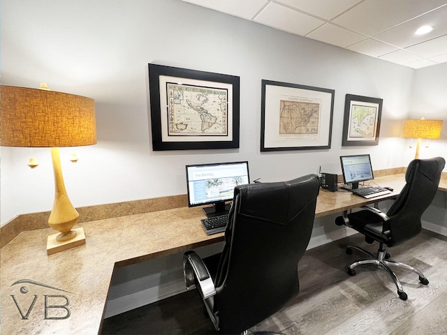 office area featuring a drop ceiling and hardwood / wood-style floors