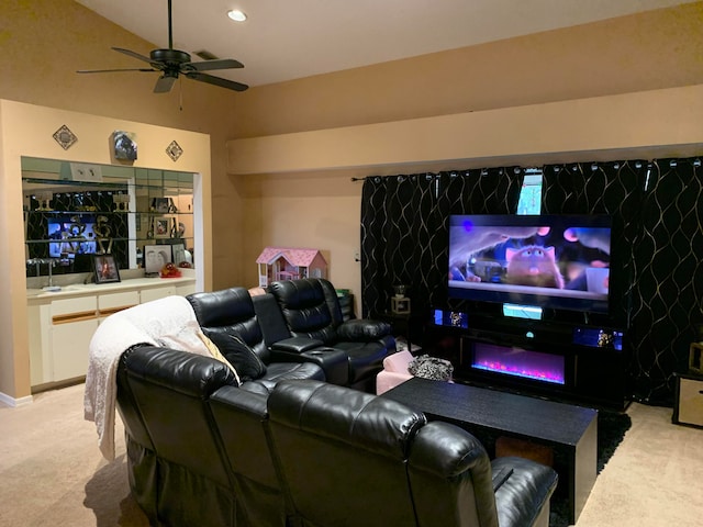 carpeted cinema featuring ceiling fan