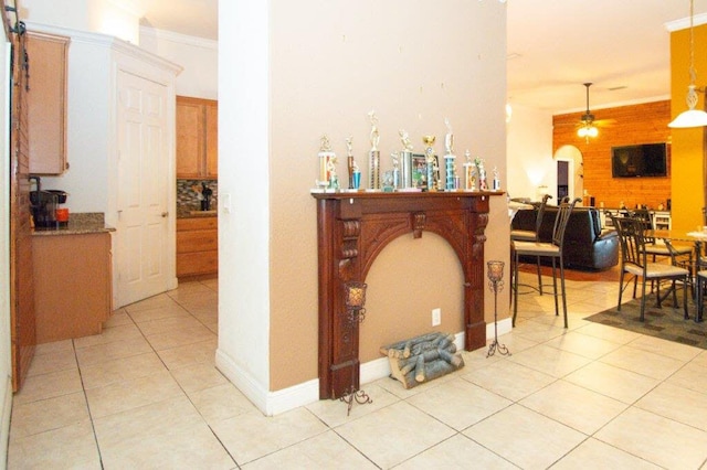 1640 SW Burlington St, Port Saint Lucie, FL 34984 - bar area with a ceiling fan, light tile patterned floors, crown molding, and pendant lighting