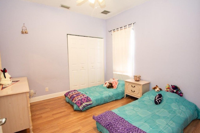 bedroom featuring a closet, ceiling fan, and light hardwood / wood-style floors