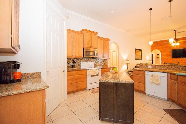 kitchen featuring pendant lighting, white appliances, backsplash, a center island, and light tile patterned flooring