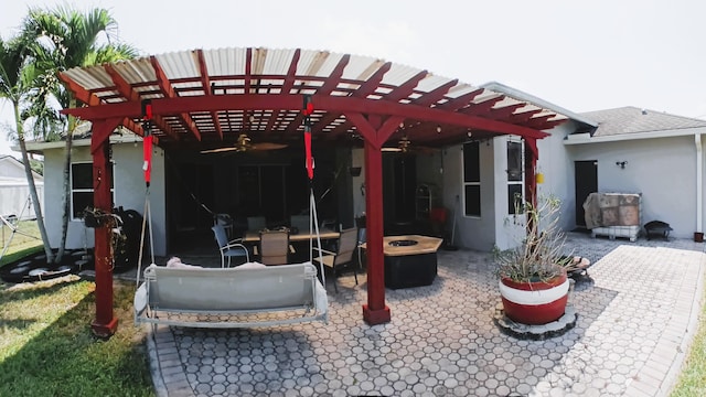 back of house featuring a pergola and a patio