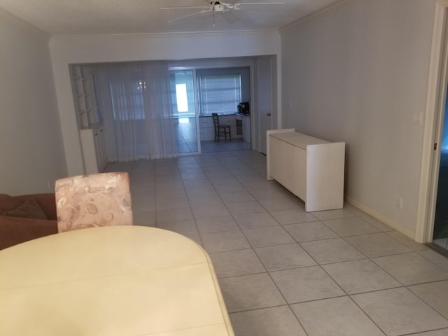 living room with ceiling fan, crown molding, and light tile patterned flooring