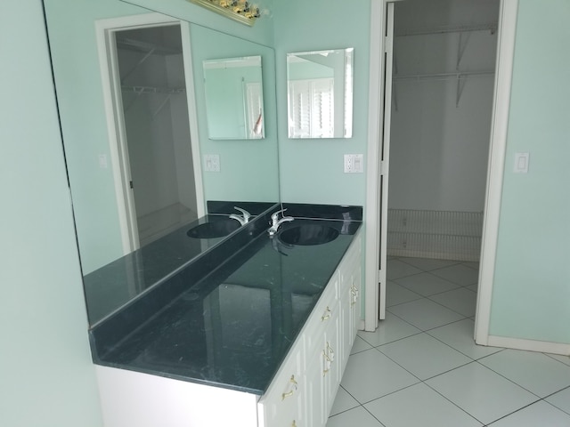 bathroom featuring tile patterned flooring and vanity