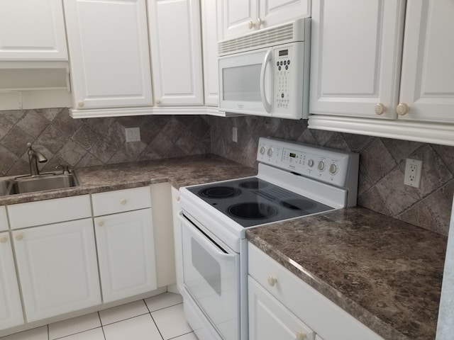 kitchen with white cabinetry and white appliances